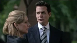 Man and woman talking in a park — Suits