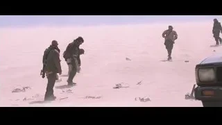 men walking in dusty desert landscape — Iron Man