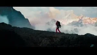 person on rocky cliff overlooking mountains — The Secret Life of Walter Mitty