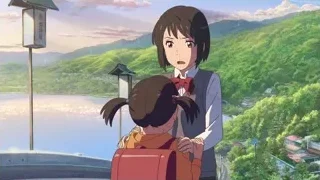 girl and boy embracing on building — Your Name