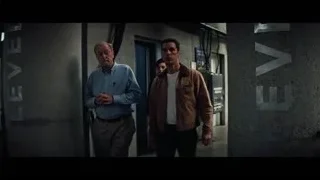 two men walking in industrial hallway — Interstellar