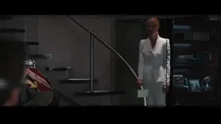 woman in white blazer by staircase — Iron Man 3