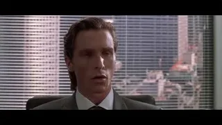 man in suit in office deep in thought — American Psycho