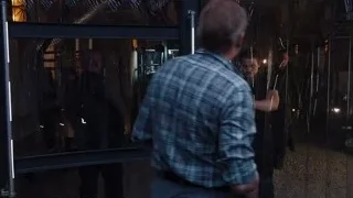 man holding gun in dimly lit room — The Avengers