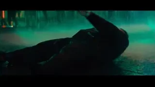 man in distress in dim room — John Wick: Chapter 4