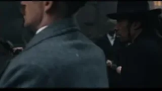 men in alleyway with one holding gun — Peaky Blinders