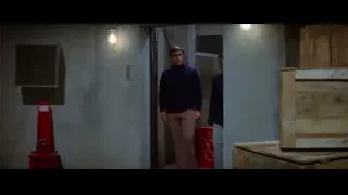 man lying exhausted on dirty floor — Bruce Lee: Enter The Dragon