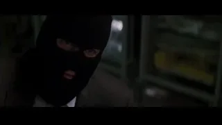person in balaclava and suit — Batman: The Dark Knight Rises