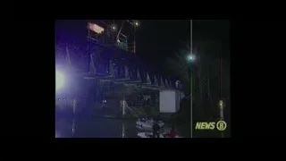 illuminated bridge at night with NEWS 8 sign — Now You See Me 2