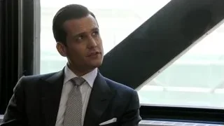 Man in suit by open window — Suits