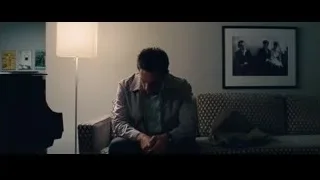 man sitting on couch reading paper — The Secret Life of Walter Mitty