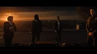 men in suits on rooftop at sunset — John Wick: Chapter 4