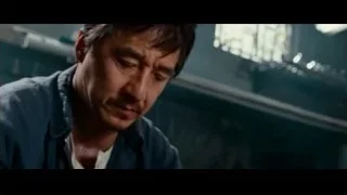 Man holding tray in cluttered room — The Karate Kid