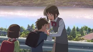 Three children on balcony overlooking city — Your Name