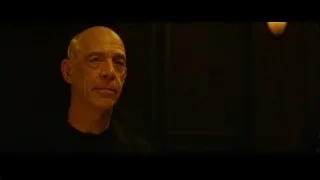 bald man in dimly lit room — Whiplash