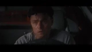 young man deep in thought in dimly lit car — The Wolf Of Wall Street