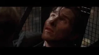 man's face speaking in cage — Batman