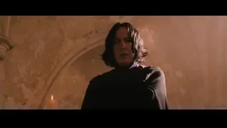 Man in black robe with candle — Harry Potter and the Philosophers Stone