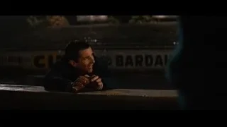 Man sitting on concrete bench at night — Ford v Ferrari