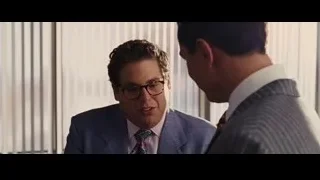 two men in suit conversing in room — The Wolf Of Wall Street
