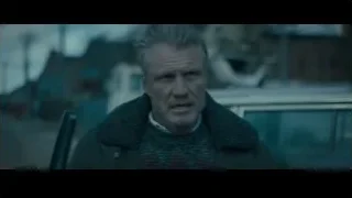 man with beard in green jacket — Creed 2