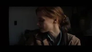 woman with messy bun in dark room — Interstellar