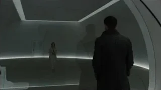 Man and woman in futuristic curved room — Blade Runner 2049