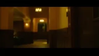 person sitting in dimly lit hallway — Whiplash