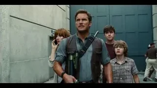 man with gun walking on street — Jurassic World