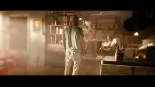 man standing with woman sitting in room — Deadpool 2