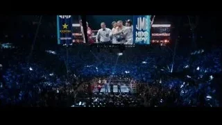 boxing match in arena with screen display — Southpaw