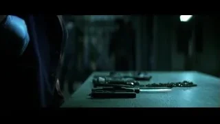 Hand cutting metal with knife on table — Batman: The Dark Knight