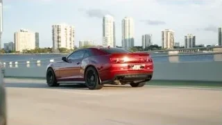 red sports car driving on highway — Sports Cars