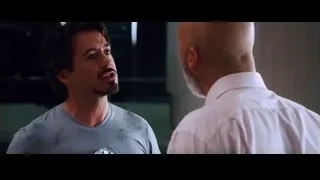 two men engaged in conversation — Iron Man