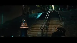 person on stairs in dark alley — John Wick: Chapter 4