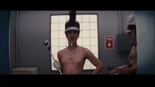 Man in suit with feathered hat dancing in office — The Wolf Of Wall Street
