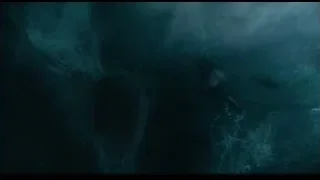 large wave crashing with dark object — Life of Pi