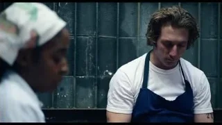 man in apron with eyes closed — The Bear