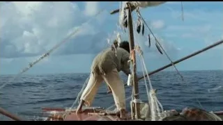 Man on sailboat holding wooden pole — Life of Pi