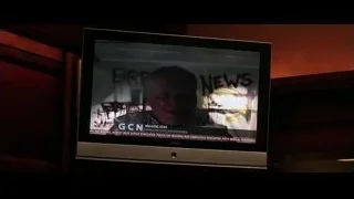 TV screen displaying breaking news on wooden wall — Batman: The Dark Knight