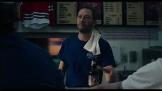 Man holding beer speaking in kitchen — The Bear