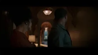 man and woman talking in arched room — Creed 3
