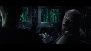 bald man at computer with green binary code — The Matrix