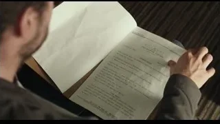Man reading newspaper on couch — Life of Pi