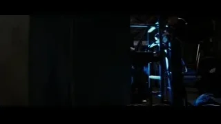 dark room with blue light and equipment — Batman: The Dark Knight Rises