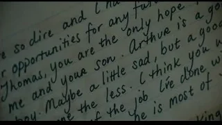 Man reading handwritten note on couch — Joker