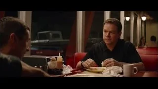 two men sitting at diner table — Ford v Ferrari