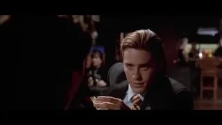man in suit at dimly lit bar — American Psycho