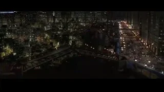 Aerial view of city at night with bridge — Batman