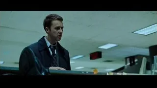 man in suit behind cluttered office desk — Fight Club